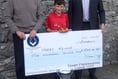 Cheque boost for young cricketer Harry