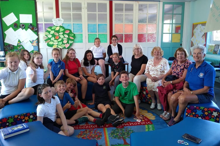 Manorbier Primary School pupils with members of Tenby and District Soroptimists