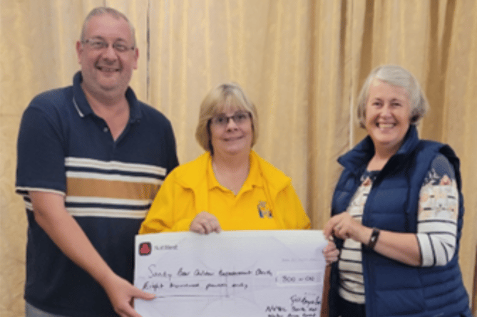 South West Wales Vintage Tractor and Engine Club present cheque to Sandy Bear
