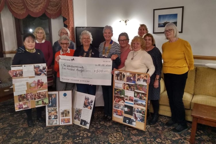 Soroptimists presenting Carole Brinton Thomas with a cheque for £500 for the Water Bearers charity