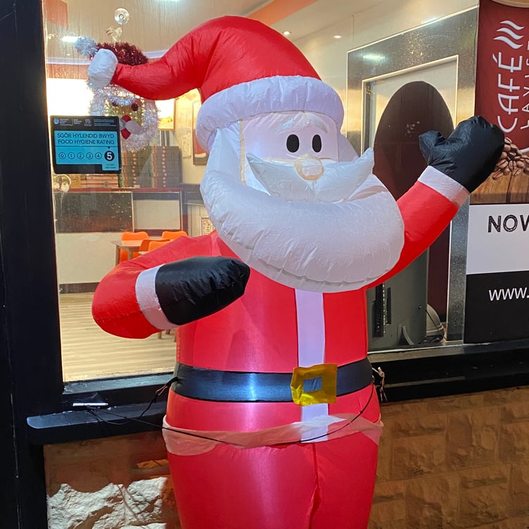 Inflatable Santa outside a Pembroke Dock takeaway.