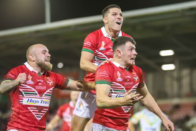 Rhodri Lloyd celebrates scoring a try against Cook Islands in Rugby League World Cup 2021