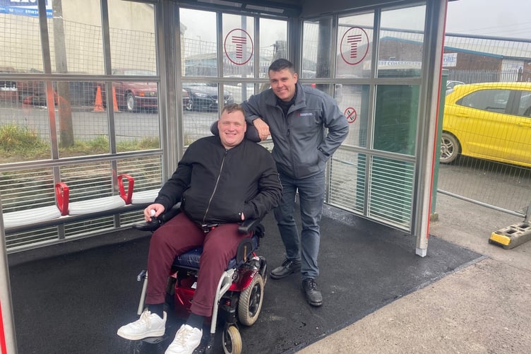 Passenger Matthew Marchant at Johnston station with station manager James Nicholas.