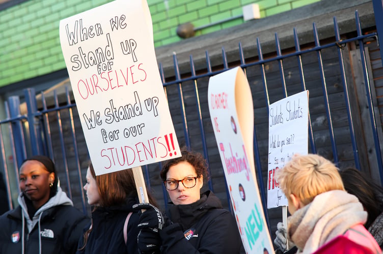 Teachers striking outside Filton Avenue Primary School. Tens of thousands of schools across England and Wales have been forced to partially close or shut their doors entirely as teachers walk out over pay. Bristol. 01 February 2023.