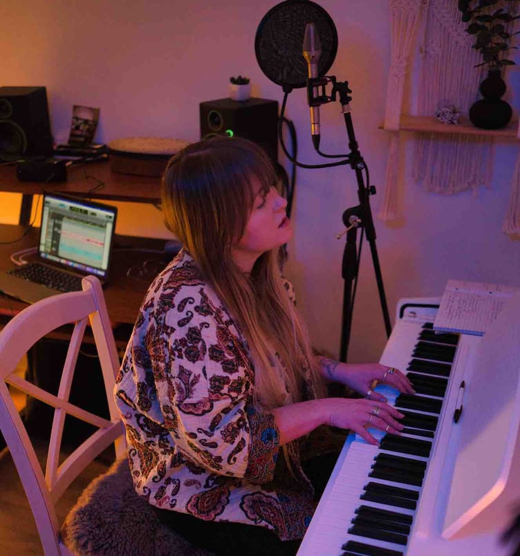 Pembrokeshire musician Jodie Marie recording in the cabin on Seiland