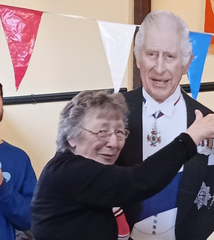 At the coronation celebrations at St Johns on Bank Holiday Monday, there was much cake, a little wine and a lot of tea, great live music from Billy Cole and some dancing and many guests including this surprise guest who danced with Mollie Neate.
