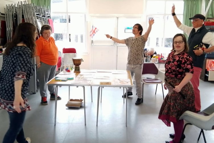 Tenby Project members enjoying music with Jim Cornwell