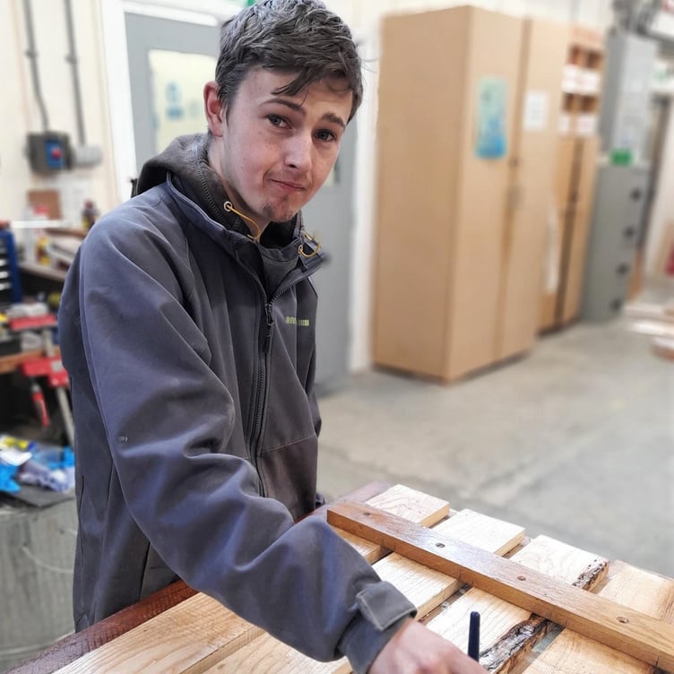Max making wooden goods in the workshop
