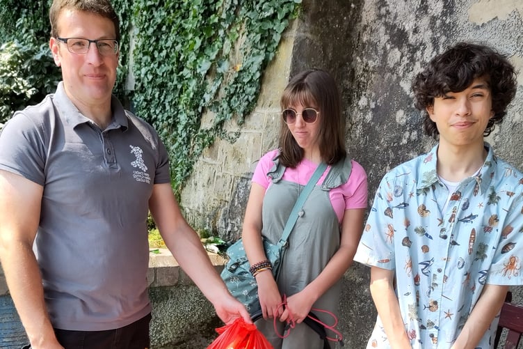Litter picking group on the North Beach zig-zag in Tenby