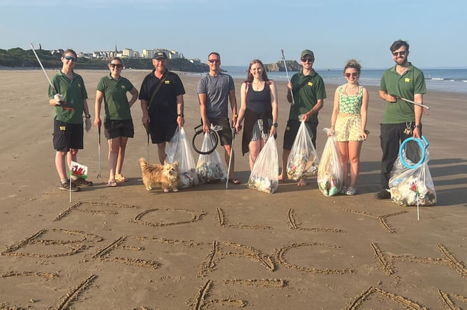 Folly Farm’s Pippa, Rosie, Alan (and Saffy the puppy), Rhys, Kim, Jack, Becky and Dan on Tenby’s South Beach with the plastic and litter they had collected
