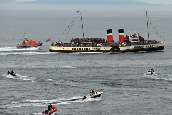 RNLI escorting the Waverley on her departure from Tenby