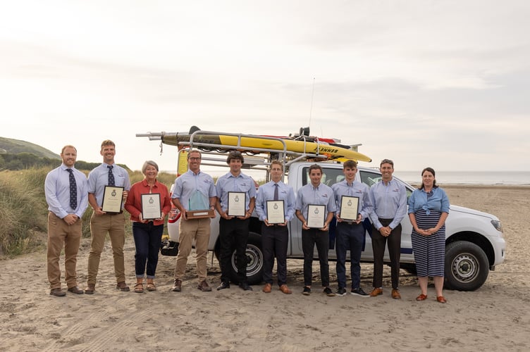 Newgale RNLI lifeguards and Ceredigion lifeguards are congratulated on receiving their Alison Saunders awards by Lifeguard Leads Pete Rooney and Jo Price.