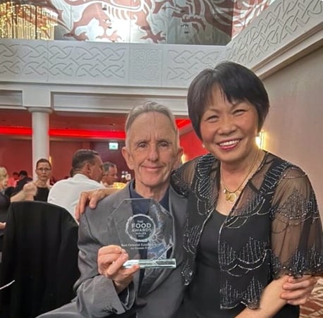 Greg and Kim of Lotus Pendine at the Food Awards Wales 2023 with their Best Oriental Establishment award.