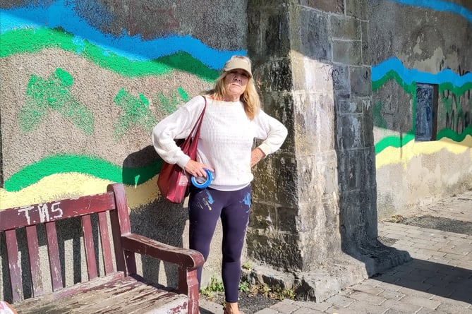 Liz Tobin by the outline of the mural at Tenby’s North Beach zigzag approach.