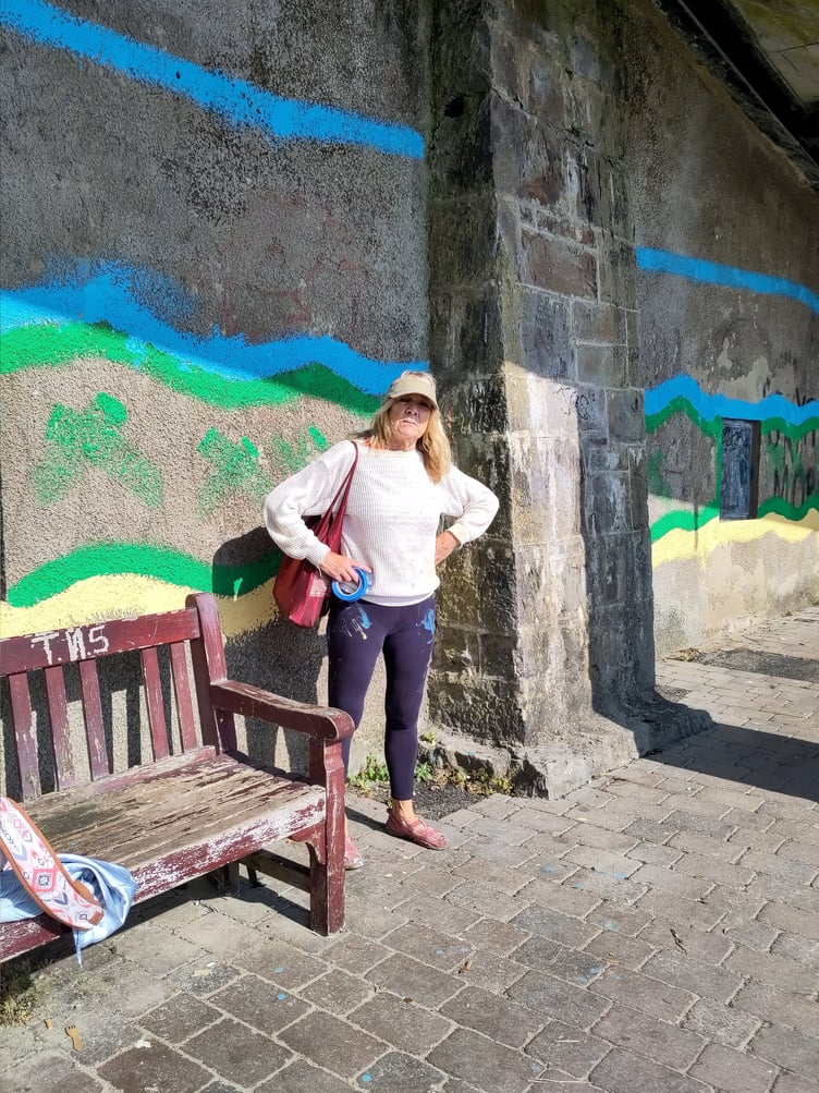Liz Tobin by the outline of the mural at Tenby’s North Beach zigzag approach.