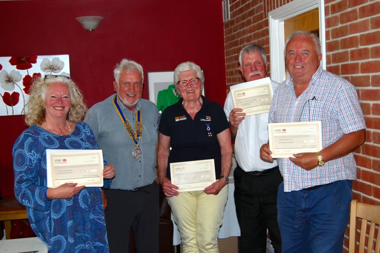 Pictured from left to right are Victoria Jones representing Kids Cancer Charity; President Rotarian Gavin Lloyd; Daphne Bush, RNLI Pembroke Branch; Peter Kraus, West Wales Maritime Heritage Society; Ian Eynon, Clarby Road Warriors (Pembrokeshire Disability Football).