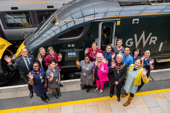 Colleagues from the Imperial College Healthcare NHS Trust with Aneira Thomas, historian Emma Snow and Tredegar Town Mayor Cllr Glyn Evans with GWR train named for NHS anniversary