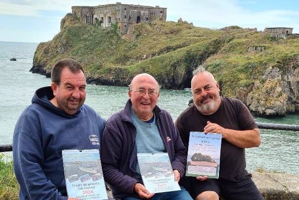Albie Smosarski of Cofion Books is pictured, (centre) with Matthew Fry (left) and Andi Jones of St CatherineÕs Island and Fort with the Tenby Memories 2024 Calendar at the launch this week.