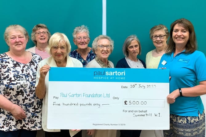 Summerhill WI ladies presenting a cheque for £500 to Paul Satori as a result of two recent bottle stalls.