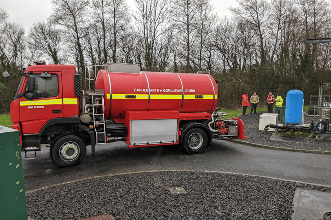 Mid and West Wales Fire and Rescue Service Water Bowser refilling at a treated UV water site.