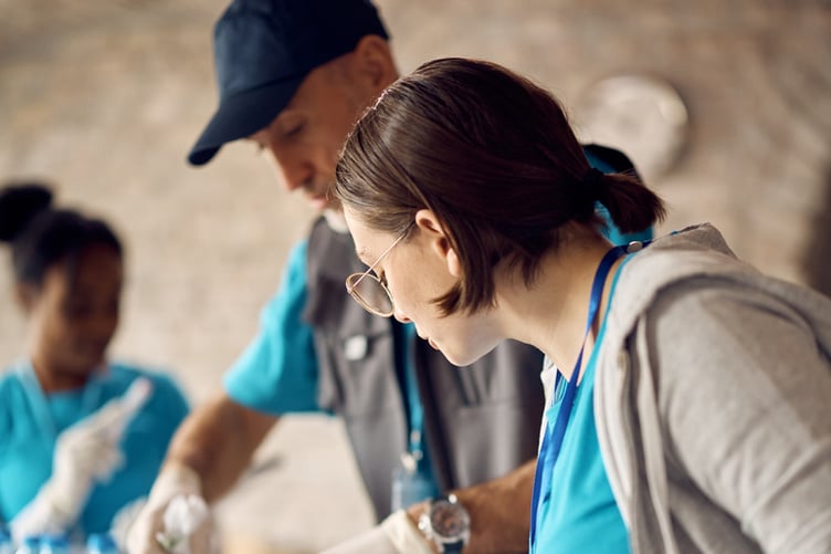 Young people volunteering . Do not use with any other story.