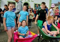 Children take part in wheelbarrow push at Whitland