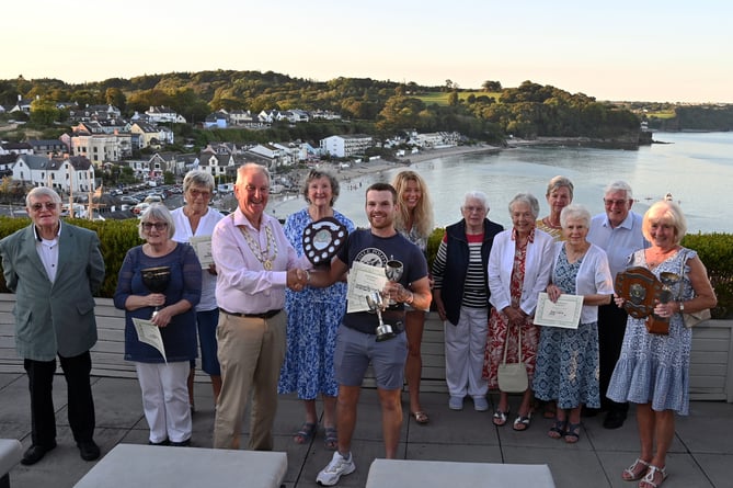 Pictured with the prizewinners and the judgers are Saundersfoot in Bloom chairman Ruth Williams, treasurer Michelle Evans, secretary Rosemary Hayes MBE and members Joan Nichols, Linda Titterton, Julie Davies, Bryan Harries, Debbie Ludlow, vice chairman Joan Allen and the chairman of Saundersfoot Community Council, Cllr Martyn Williams BEM.