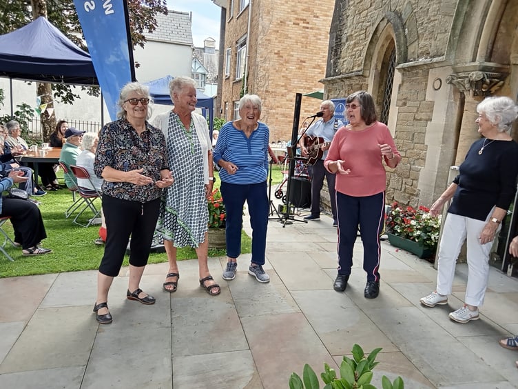 Dancing at the St Johns Teddy Bear picnic afternoon tea party to music played by Billy Cole