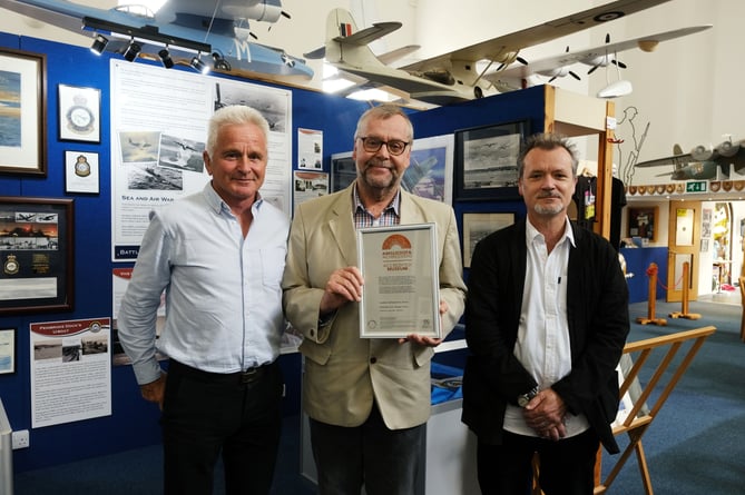 Collections Trustee Trevor Clark displays the Accreditation Certificate, together with Museum Mentor Mark Lewis (right) and Wing Commander Tim Payne.