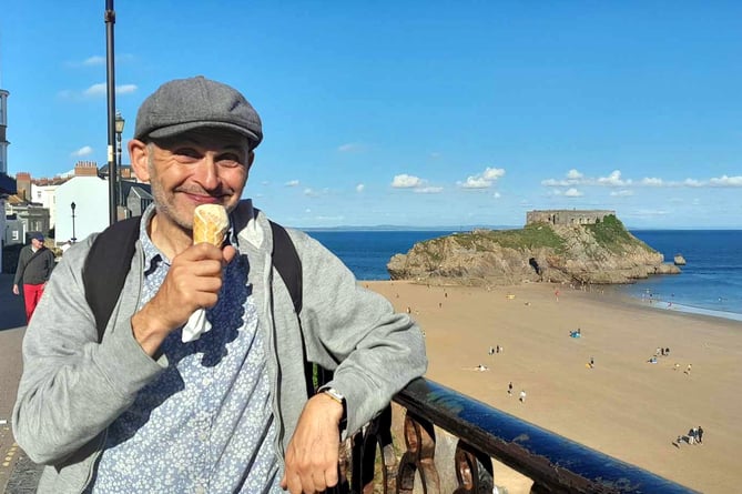 Writer and performer Robert Cohen fulfilling a childhood dream in returning to Tenby, seen sampling a Welsh cake-flavoured ice-cream on the Paragon.