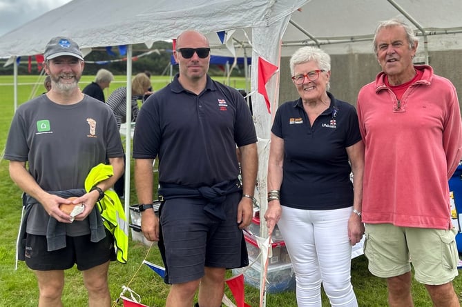 Pictured are: Mark Vines who ran the course in 33 mins; Lewis Creese, RNLI Angle Station Coxswain; Daphne Bush, Chair of Pembroke Ladies Lifeboat Guild and Phil Bradden of event sponsor Pembroke Packaging.