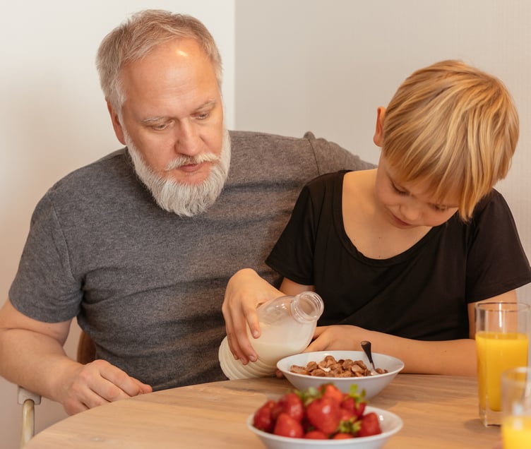 https://www.pexels.com/photo/a-boy-pouring-milk-on-his-cereal-bowl-8307483/