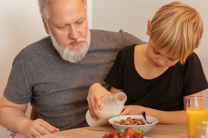 https://www.pexels.com/photo/a-boy-pouring-milk-on-his-cereal-bowl-8307483/