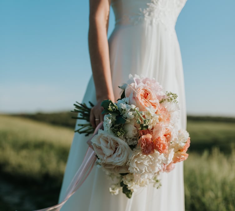 Slim bride with bouquet