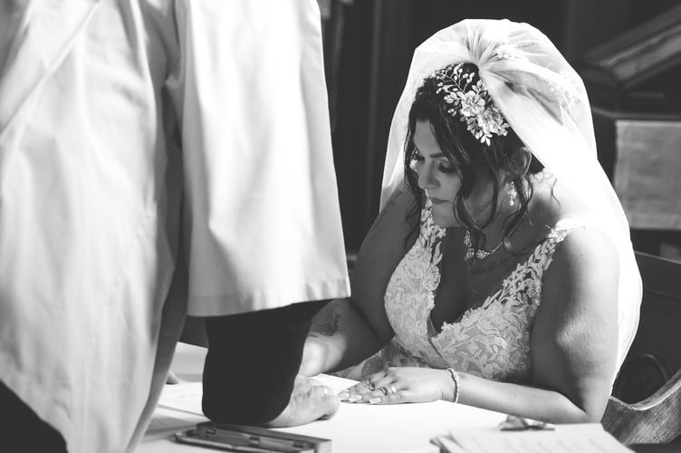 Stacey and Tom wedding photo - Signing the register