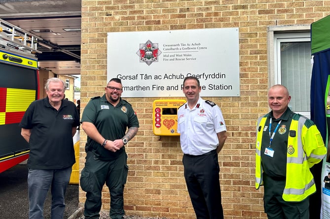 From left to right: Save a Life Cymru Chair Professor Len Nokes, Nick Ozzati from the Welsh Ambulance Service Trust, Chief Fire Officer Roger Thomas and Save a Life Cymru Community Co-ordinator Marc Gower.