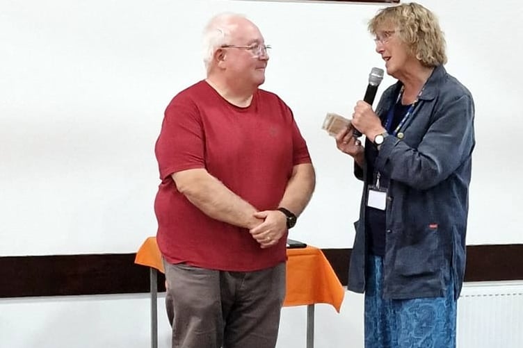 Kevin From VC Gallery receives the Pembroke Soup donation from Joan Marsh
