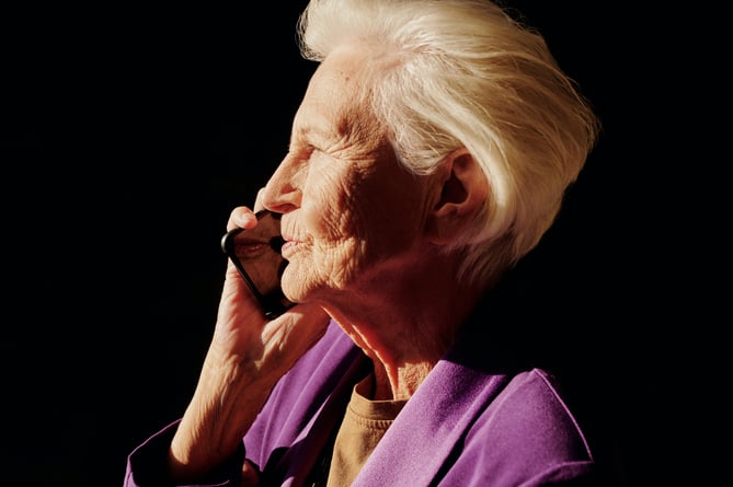 Old woman talking on phone