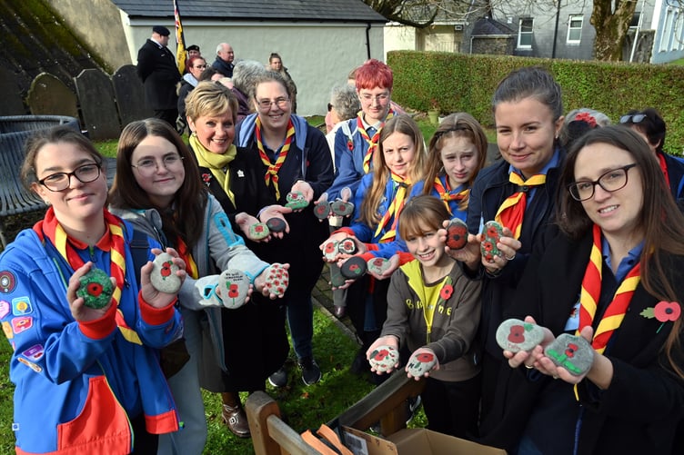 Uniformed organisations, young people, representatives of the British Legion and members of the community brought painted stones and pebbles to St. Mary’s as part of the Town’s act of commemoration.