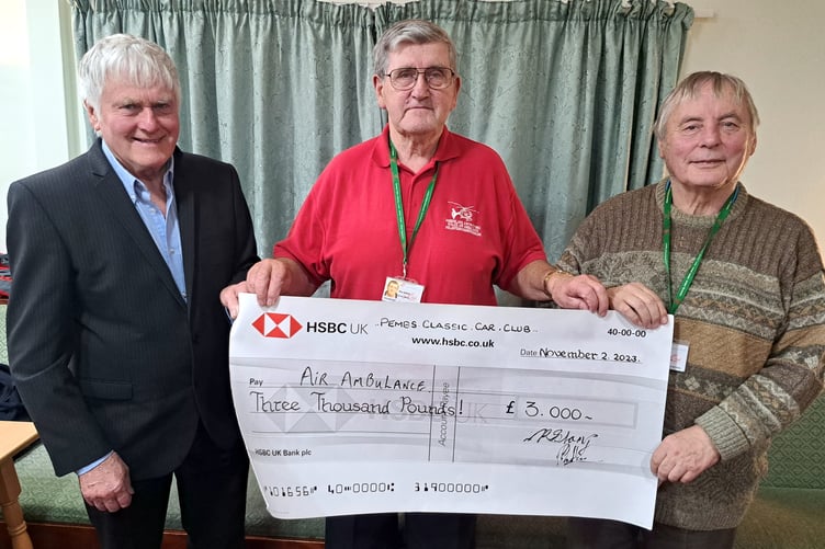 Club Chairman Mike Chilton presenting Rhys Watkins and Noel Evans of Wales Air Ambulance with a cheque for £3,000