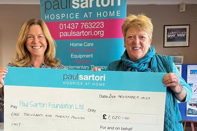 Previous Trustee and Voting Member of the Paul Sartori Foundation Sara Alderman is handed a cheque from Ladies Captain Joanne Owen.