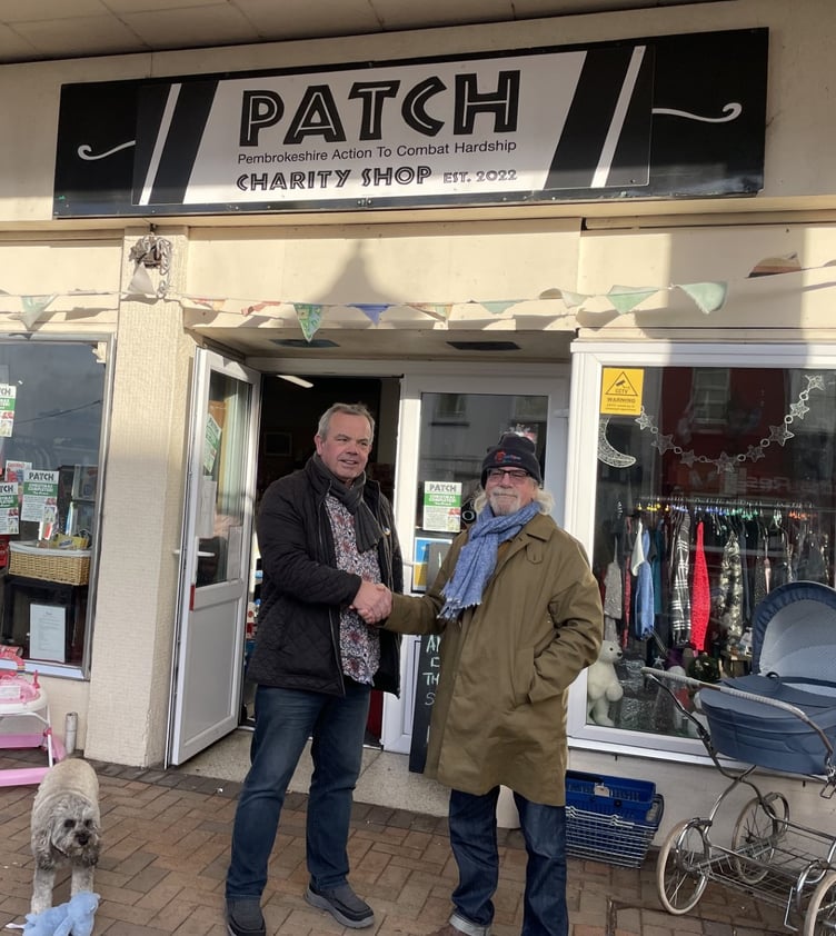 Presenter BB Skone hands over a cheque of £500 to Dave Goulding of PATCH following the successful Tenby Blues Festival.