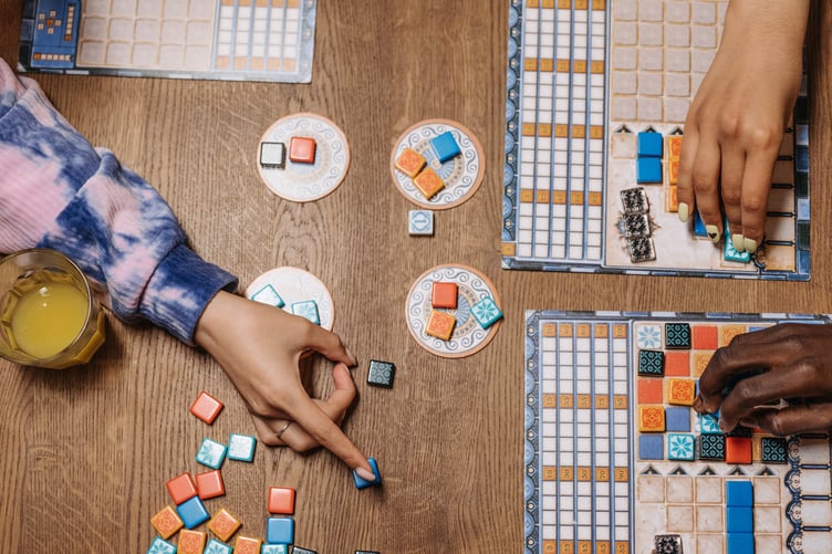 Photo by Pavel Danilyuk: https://www.pexels.com/photo/hands-playing-board-games-8111328/