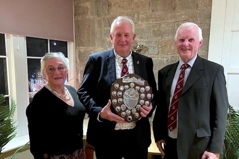 David Phillips holding the shield, with President Michael Colley and lady Chairman Elizabeth Minchin.