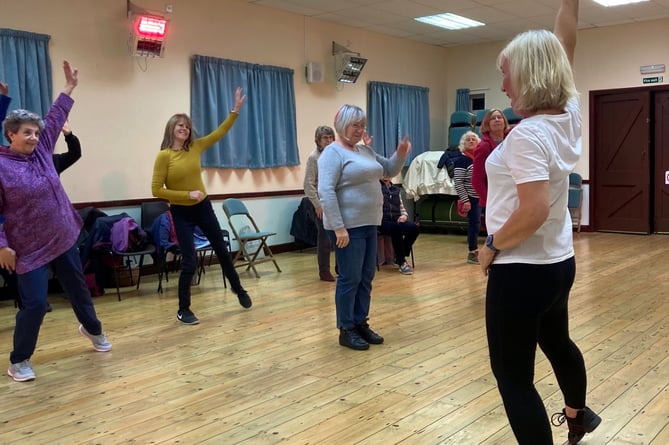 Members of Cosheston WI trying out Fit Steps with Helen John.