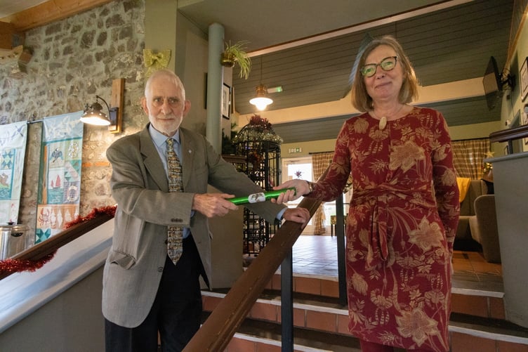Steve Drinkwater hands the baton on to new Chair, Clare Dow, at the Friends Christmas Lunch