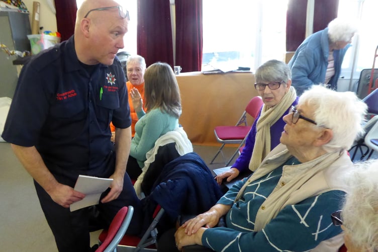 Lee Simmons of the Tenby Fire Brigade with Friendship Club member Gertie.