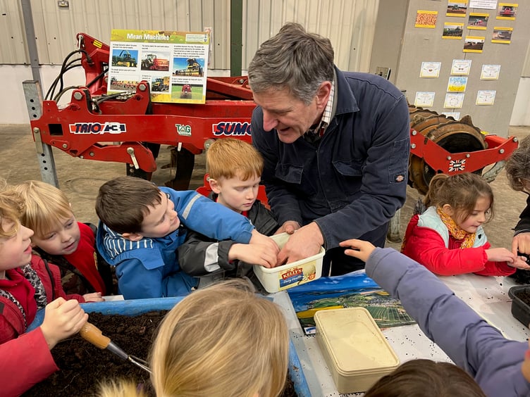 Ysgol Bro Ingli year 2 pupils getting hands on with arable farmer Walter Simon