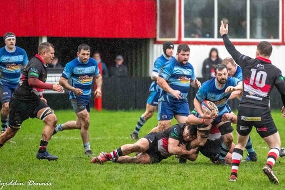 Richard Rees driving forward with the ball.