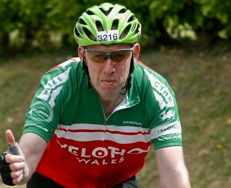 Narberth postman Dorian Rees when he cycled 850 miles for Ward 10 in Withybush Hospital.